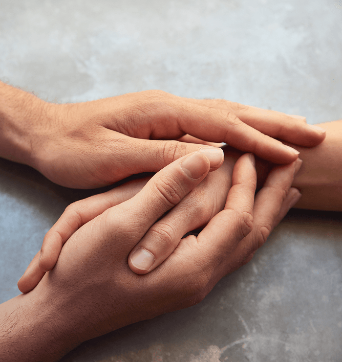 holding hands symbolizing support and unity during rehab admission process
